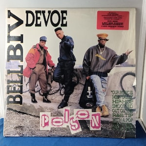 May include: A vinyl record cover for Bell Biv DeVoe's Poison album. The cover features three individuals standing in front of a concrete wall with graffiti. Text on the cover includes the group name, album title, and a pink promotional sticker.