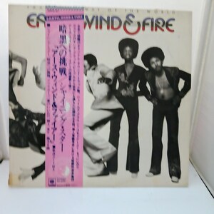 May include: Album cover for Earth, Wind & Fire's "That's the Way of the World." The cover features the band members in various poses, with the band's name in red and blue. A pink sticker with Japanese text is on the left.
