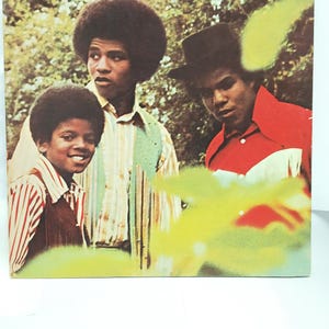 May include: Album cover featuring The Jackson 5. The album cover has a photo of three members of the group. The album title "Maybe Tomorrow" is at the top left. The group's name, "Jackson 5", is at the top right.