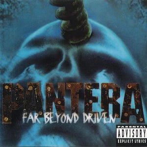 May include: Album cover for Pantera's "Far Beyond Driven." The cover features the band's name in a distressed, bolted-on font. The background is a blue skull with a green, twisted object on top. A parental advisory label is in the bottom right.