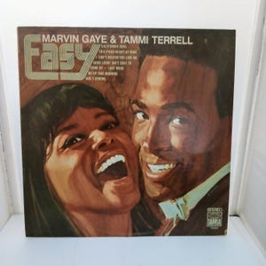 May include: Vintage vinyl record album cover featuring Marvin Gaye and Tammi Terrell. The album cover has the word "Easy" in large, stylized letters. The album title is "California Soul". The cover art depicts the smiling faces of the two singers.