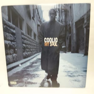 May include: Album cover for Coolio's "My Soul" featuring a grayscale image of the artist walking down a city street. The album title is in white and orange text.