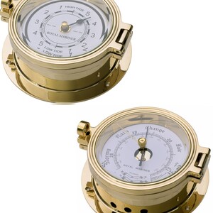 May include: Two brass nautical instruments. One is a tide clock with a white face and black numerals, labeled "Royal Mariner." The other is a barometer with a white face and a needle indicating the weather conditions.