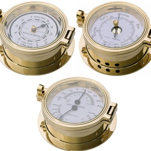 May include: Three brass nautical instruments with white faces and black hands. The instruments measure tide, barometric pressure, and temperature. The instruments are labeled "Royal Mariner".
