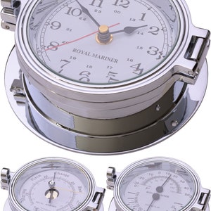 May include: A collection of nautical instruments, including a clock, barometer, and thermometer. The clock has a white face with black numerals and the text "ROYAL MARINER." All instruments have a polished silver finish.