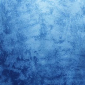 May include: A blue tie-dye pattern with varying shades of blue, creating a textured, watercolor-like effect. The design transitions from lighter shades at the top to darker hues at the bottom, with a subtle, artistic aesthetic.