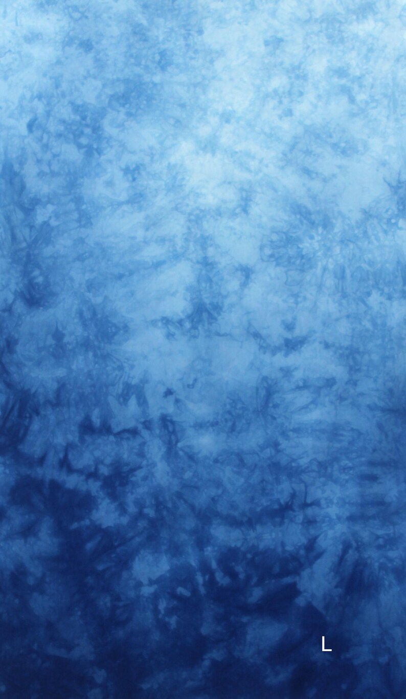 May include: A blue tie-dye pattern with varying shades of blue, creating a textured, watercolor-like effect. The design transitions from lighter shades at the top to darker hues at the bottom, with a subtle, artistic aesthetic.