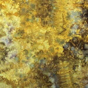 May include: A textile fabric featuring a tie-dye pattern with a blend of golden yellow, mustard, and deep brown hues. The design displays organic, mottled textures with subtle hints of muted blue and grey dispersed throughout the surface.
