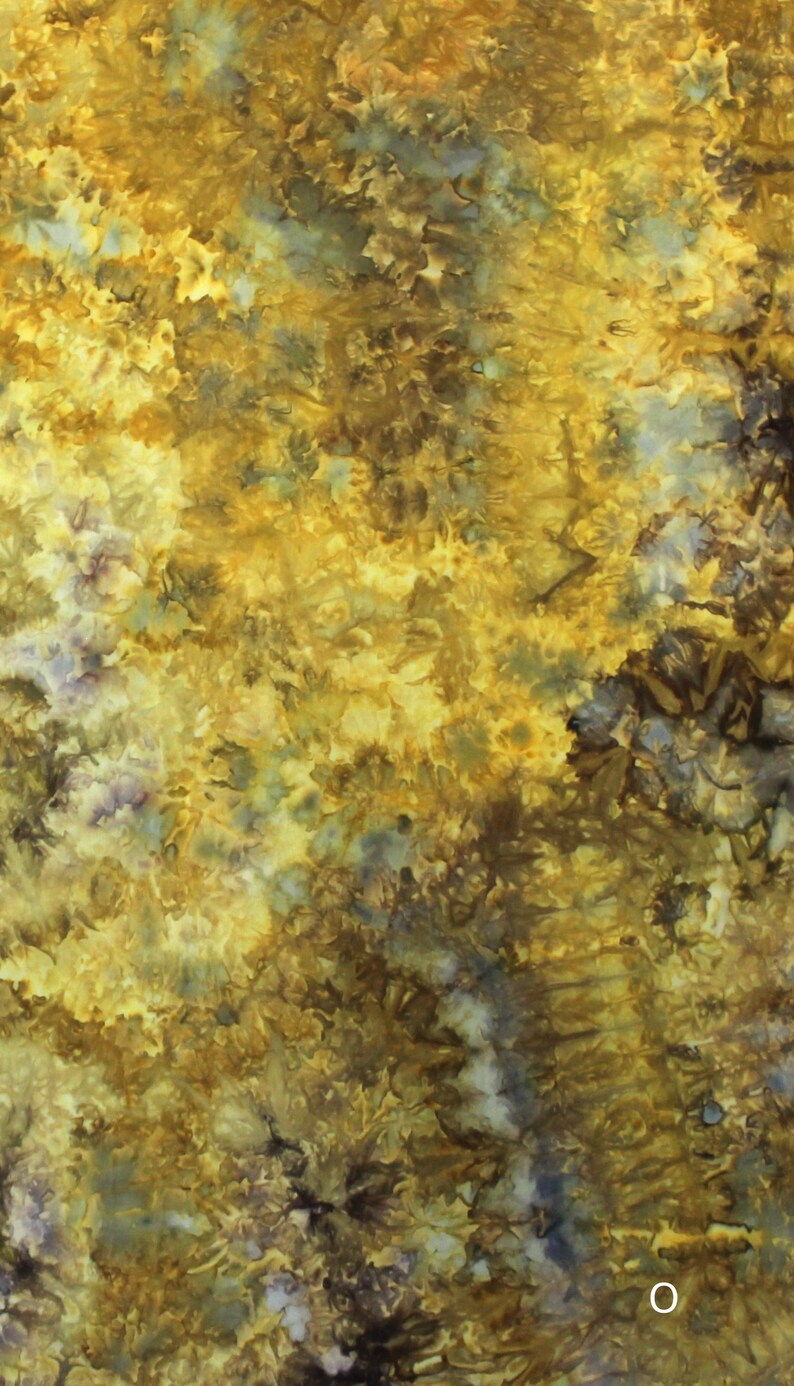 May include: A textile fabric featuring a tie-dye pattern with a blend of golden yellow, mustard, and deep brown hues. The design displays organic, mottled textures with subtle hints of muted blue and grey dispersed throughout the surface.