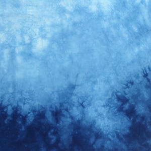 May include: A set of three ceramic mugs with a speckled, matte finish. Each mug features a different color: light blue, cream, and gray. The mugs have a simple, modern design and a comfortable handle.