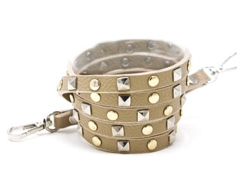 Taupe crossbody strap with gold and silver studs