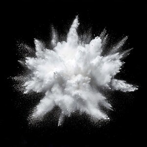 May include: A white powder explosion against a black background. The powder is dispersed in a cloud-like shape with a radial pattern.