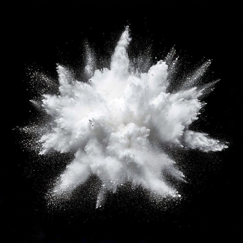 May include: A white powder explosion against a black background. The powder is dispersed in a cloud-like shape with a radial pattern.