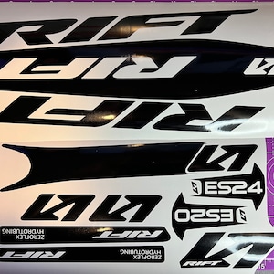 May include: A set of black and white bike decals with the word "RIFT" and the text "ZEROFLEX HYDROTUBING" on them.