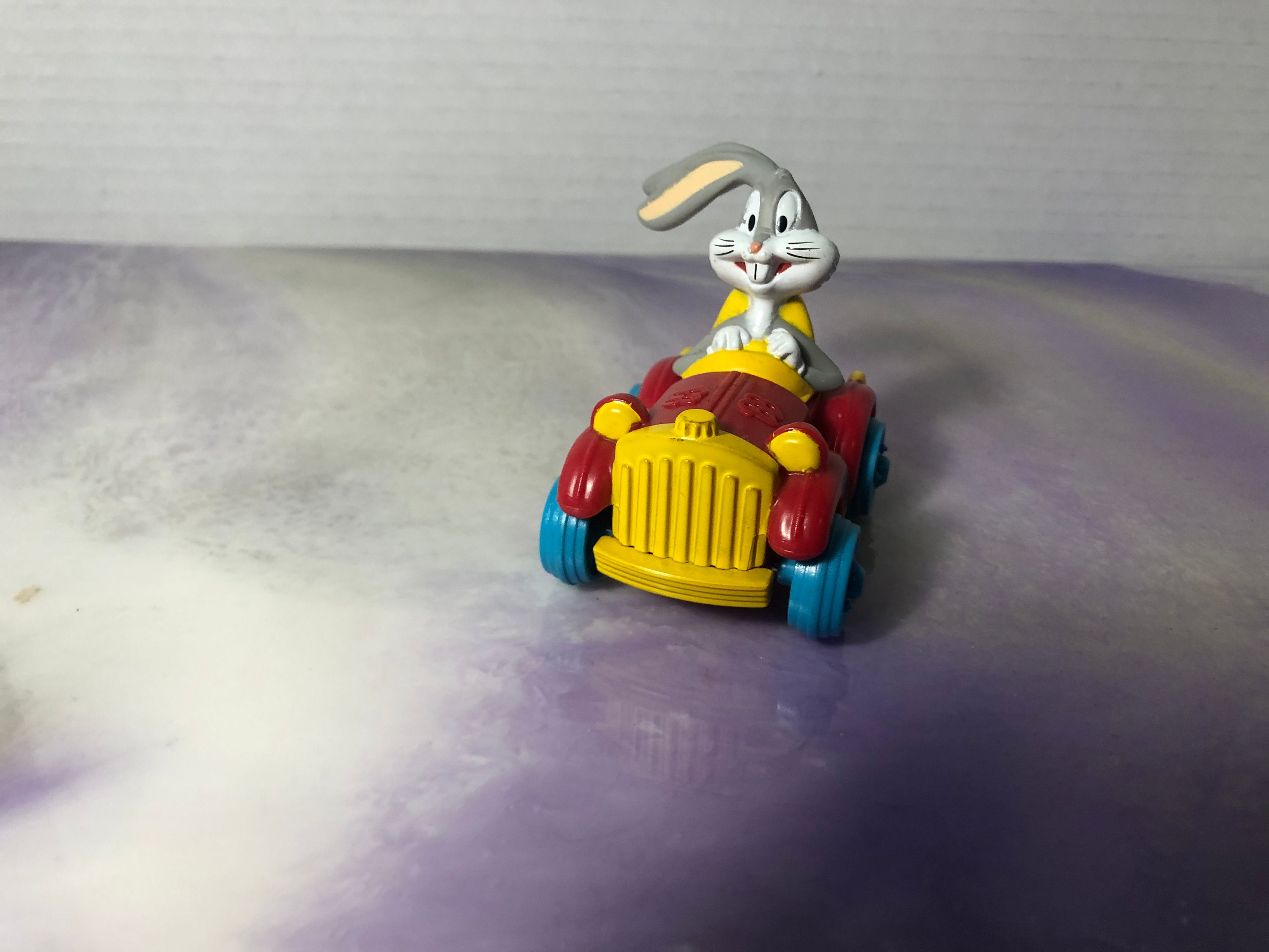 Tirelire Warner Bros Looney Tunes En Voiture - Résine - Excellent état