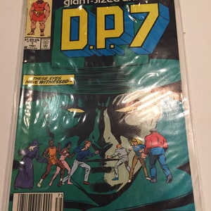 May include: A comic book cover featuring a green and yellow title "D.P.7" with the words "new universe giant-sized annual" above it. The cover features a large green face with a black mask and the text "These eyes have witnessed" below the title. There are seven figures in front of the face, including a woman in a black cloak, a man in a red shirt, and a woman in a pink dress.