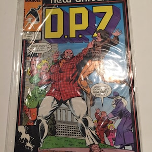 May include: A comic book titled "DP7" from Marvel's New Universe series. The cover features a dynamic illustration of a man in a red plaid shirt and white trousers, with the text "DP7" in large, colourful letters. The comic is encased in a protective sleeve.