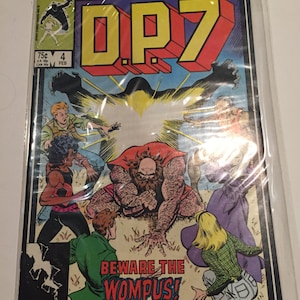 May include: A comic book cover featuring a group of people facing a large, hairy creature with the words "Beware the Wompus!" printed on the cover. The comic book is titled "DP7" and is a Marvel New Universe publication.
