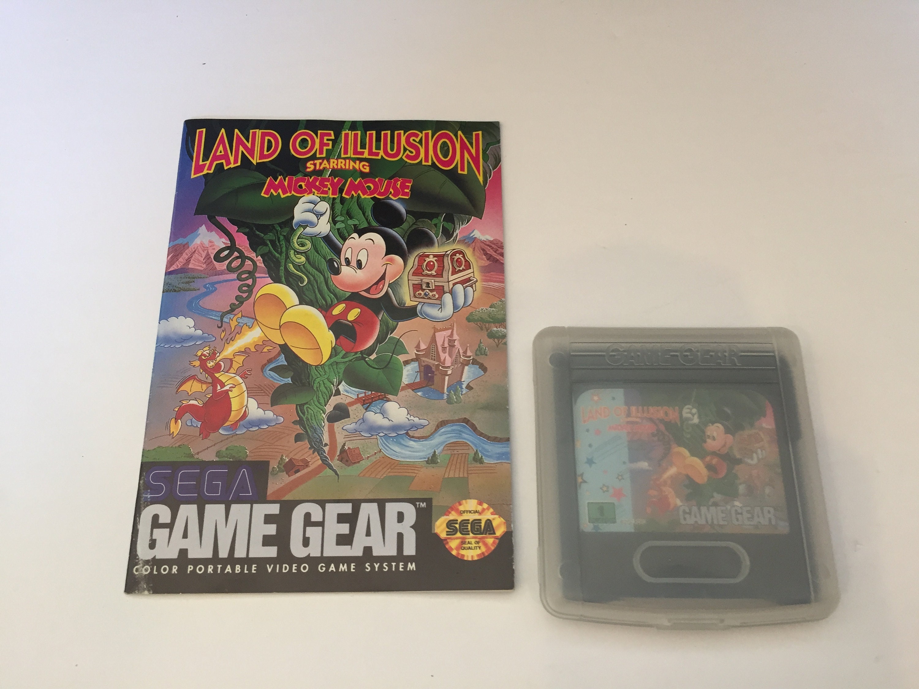 Vintage Sega Game gear with games. munimoro.gob.pe