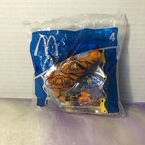 Vintage Disney Aladdin BRAND NEW Rajah the Tiger / Flying Carpet Happy Meal Toy PVC Cake Topper Rare Vintage Toy! Fun Vintage Toy!