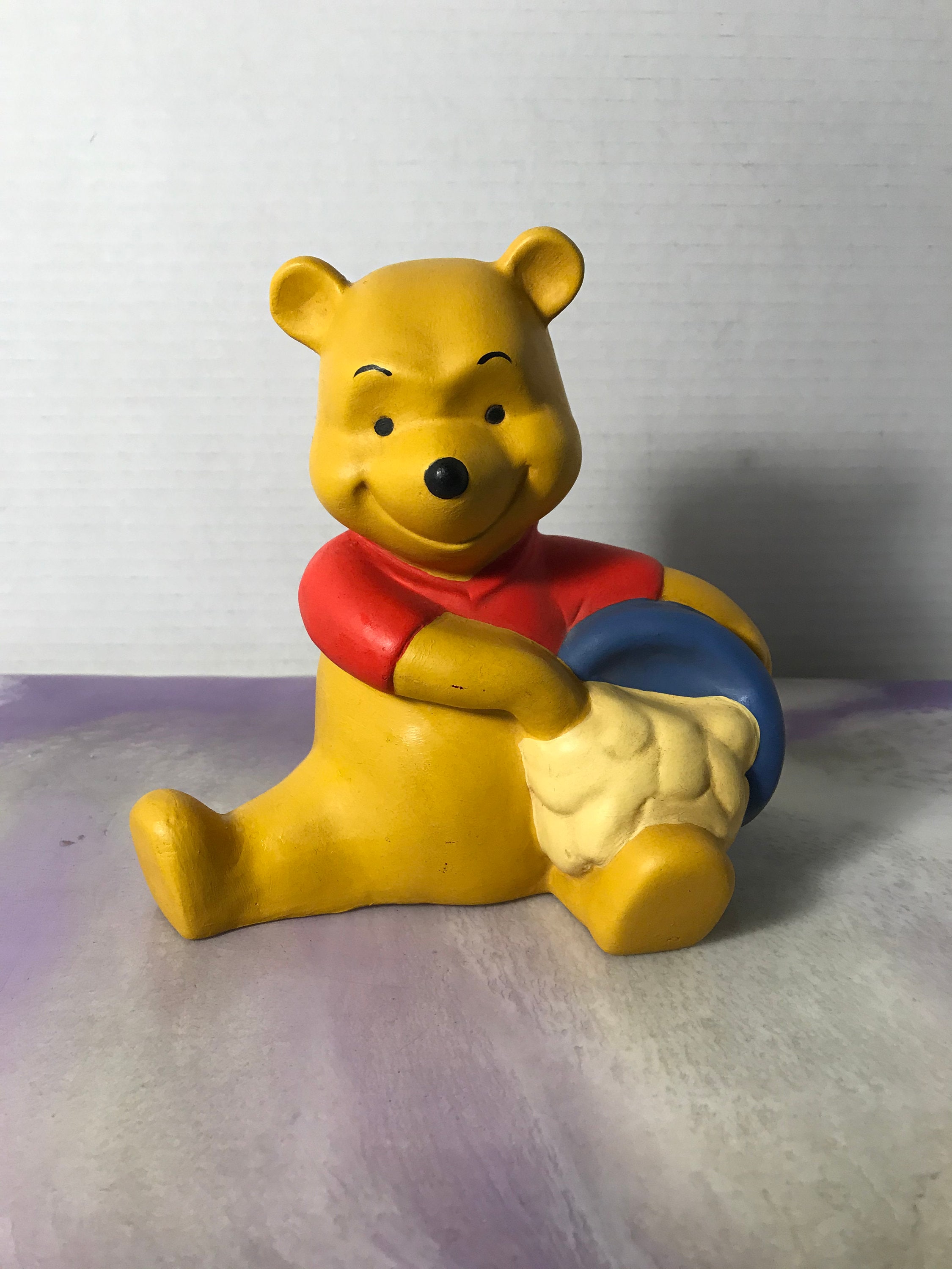 winnie the pooh stone statue