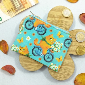 Portamonete kawaii Gatti in bicicletta: per soldi, banconote, monete, tessere e piccoli oggetti come dadi e gioielli. Per borse e tasche.