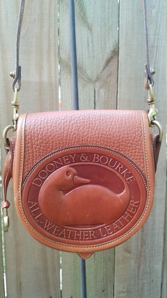 Dooney bourke all weather leather duck mini crossbody bag hotsell