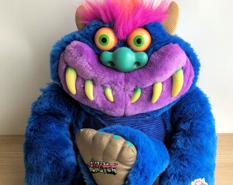 80s toy monster with handcuffs
