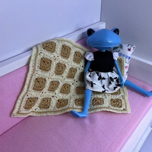 Miniature crochet granny square blanket for doll house