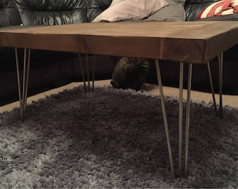 Reclaimed coffee table, hairpin legs, rustic pine top.