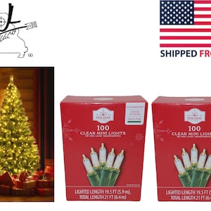 May include: Two packages of 100 clear mini lights with green wire. The packages are red with white snowflakes and the text "Holiday Time" and "100 Clear Mini Lights".