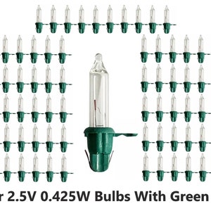 May include: 100 clear 2.5V 0.425W light bulbs with green AT base.