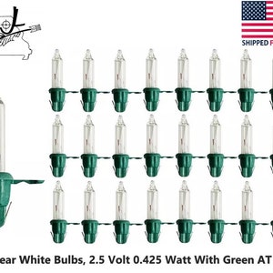 May include: 25 clear white light bulbs with green bases. The bulbs are 2.5 volt and 0.425 watt.