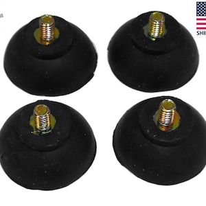 May include: Four black rubber furniture feet with a threaded metal screw in the center. The feet are designed to protect surfaces from scratches and reduce noise.