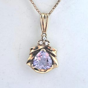 Hallmarked 9ct Gold Amethyst and Diamond pendant with chain