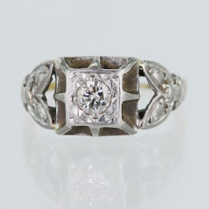 Bague solitaire art déco en or 18 carats et diamants en platine