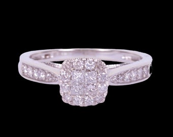 White gold and diamond cluster style engagement ring