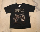 AC DC Music Promo Cannon Graphic Vintage T-Shirt Band Print For Those About To Rock We Salute You Spell Out Graphic
