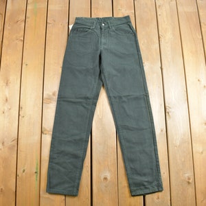 May include: A pair of dark green pants with a straight leg fit.