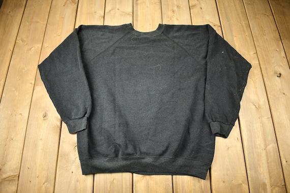 トップス 80's UNIVERSAL STUDIOS Florida SWEAT Vintage 1980s Universal Studios Florida Raglan Crewneck