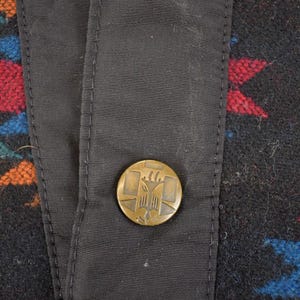 May include: A trio of ceramic mugs with a speckled, matte finish in cream, light grey, and dark grey. Each mug features a minimalist design and a rounded handle.