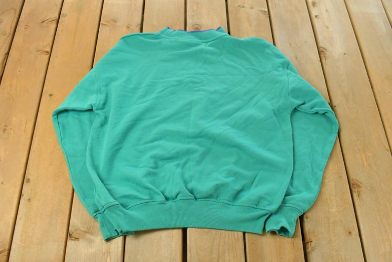 May include: A rustic wooden sign with the text "Welcome to our home" in white lettering. The sign features a distressed finish and a simple, inviting design, perfect for front door decor.