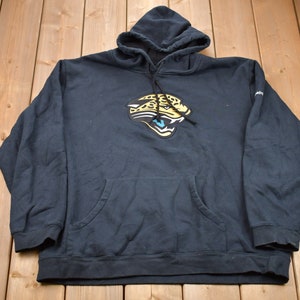 May include: Navy blue hooded sweatshirt with a front kangaroo pocket. The sweatshirt features a team logo of a jaguar's head in yellow, black, and white. The hood has a drawstring, and the sleeves have ribbed cuffs.