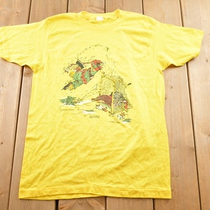 ヴィンテージ 1990年代 ゲイリー・ピーターソン 漫画 プロモ Tシャツ / 90年代 グラフィック Tシャツ / スコアグラフィック / ホッケーテーマ / ホッケーシャツ / レア漫画シャツ /