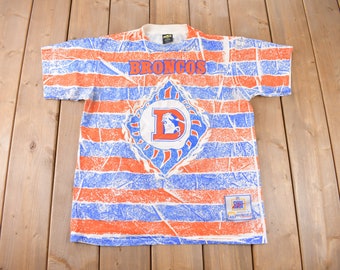 Vintage 1990s Denver Broncos NFL Football All Over Print Graphic T-Shirt Made In USA