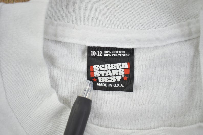May include: White tag with black text that reads "10-12 50% cotton 50% polyester" and "Screen Stars Best Made in U.S.A."