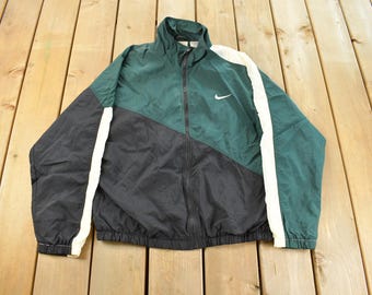 Vintage 1990s Nike Mini Swoosh Windbreaker Jacket Men's Medium / Embroidered / Streetwear / Nike Athletics / 90s Jacket / Big Swoosh