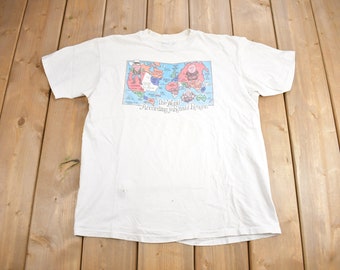 Vintage 1980s "The World According To Ronald Reagan" Graphic T Shirt / Vintage Reagan T Shirt / Graphic Tee / Single Stitch / Made In USA