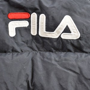 May include: Black puffer jacket with a white and red FILA logo.