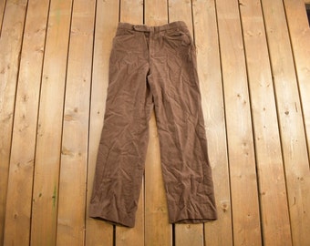 May include: A pair of brown corduroy pants.